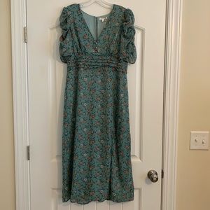 New with tags. Floral midi dress. Large. Straight fit with side slit.